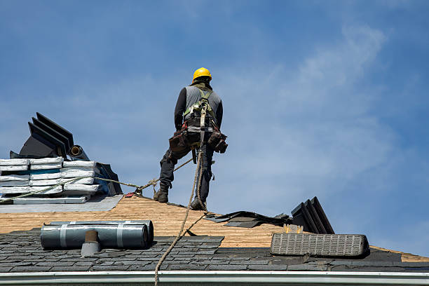 Professional Roofing technician working in Brentwood, NY